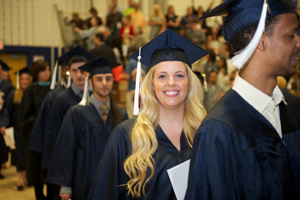 Grads walking into gym