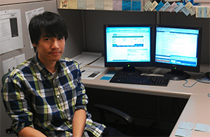 Kanel Nang sitting at his desk at USLI