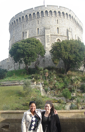 two students standing with Windosr Castle behind them