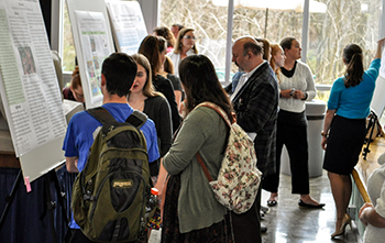 students presenting research posters at EURECA 