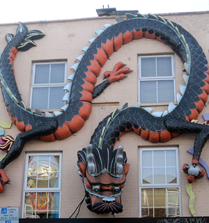 dragon sculpture on a wall in Chinatown
