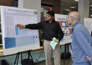 image of student with research poster