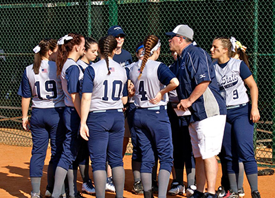 softball team in a huddle